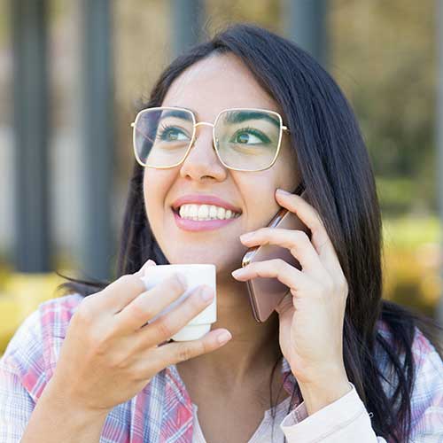 woman on phone calling Castle Pines eye care center